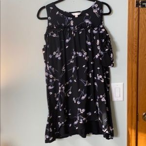 Black dress with blue flowers on it